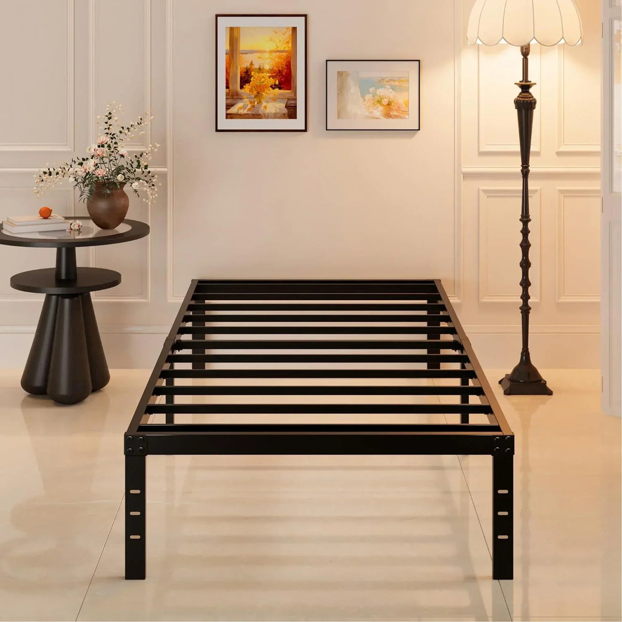 Modern black metal bed frame in a stylish room with wall art, floor lamp, and side table, HOCC UAE.