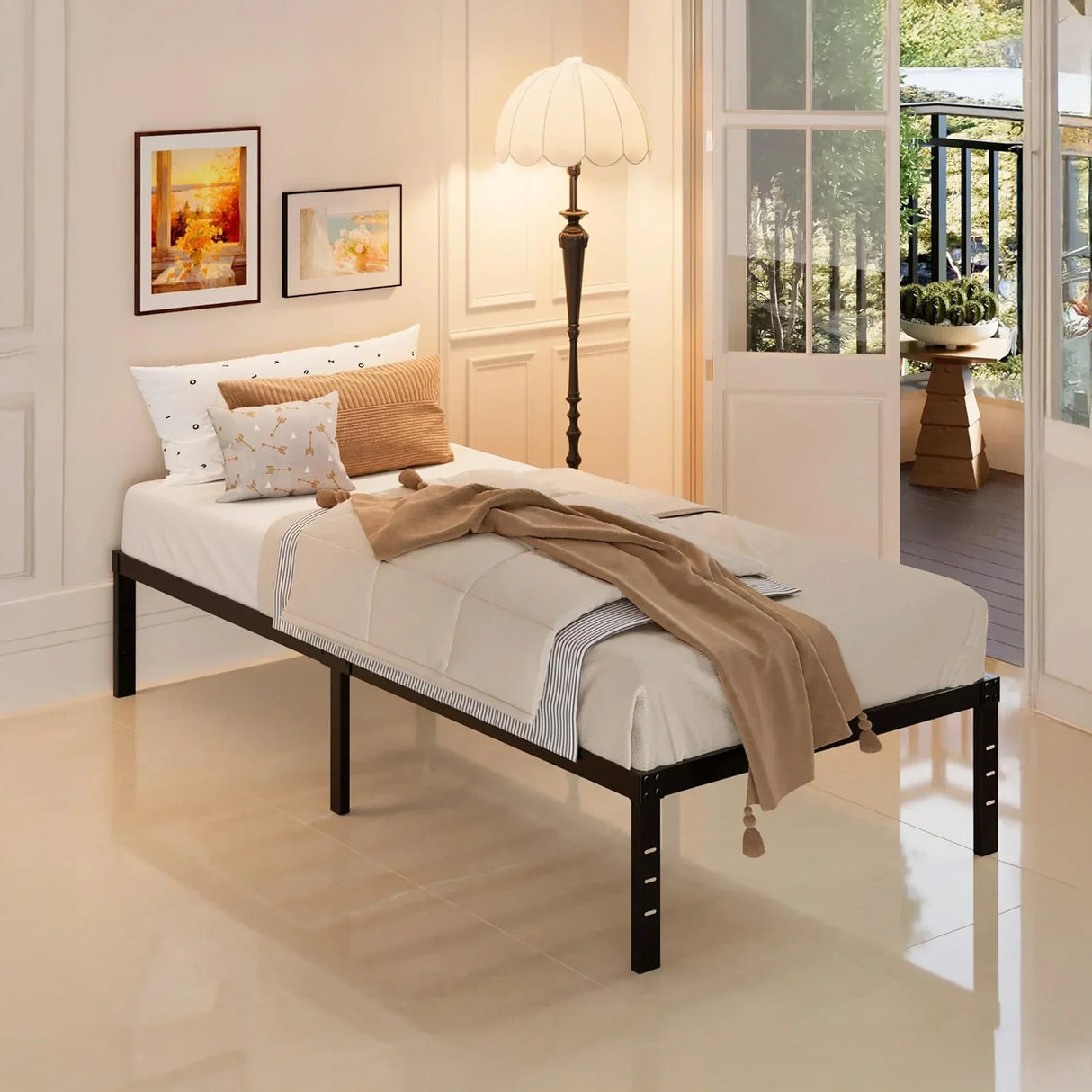 Minimalist single bed with black frame in modern bedroom, beside art, lamp, and balcony, HOCC UAE home decor