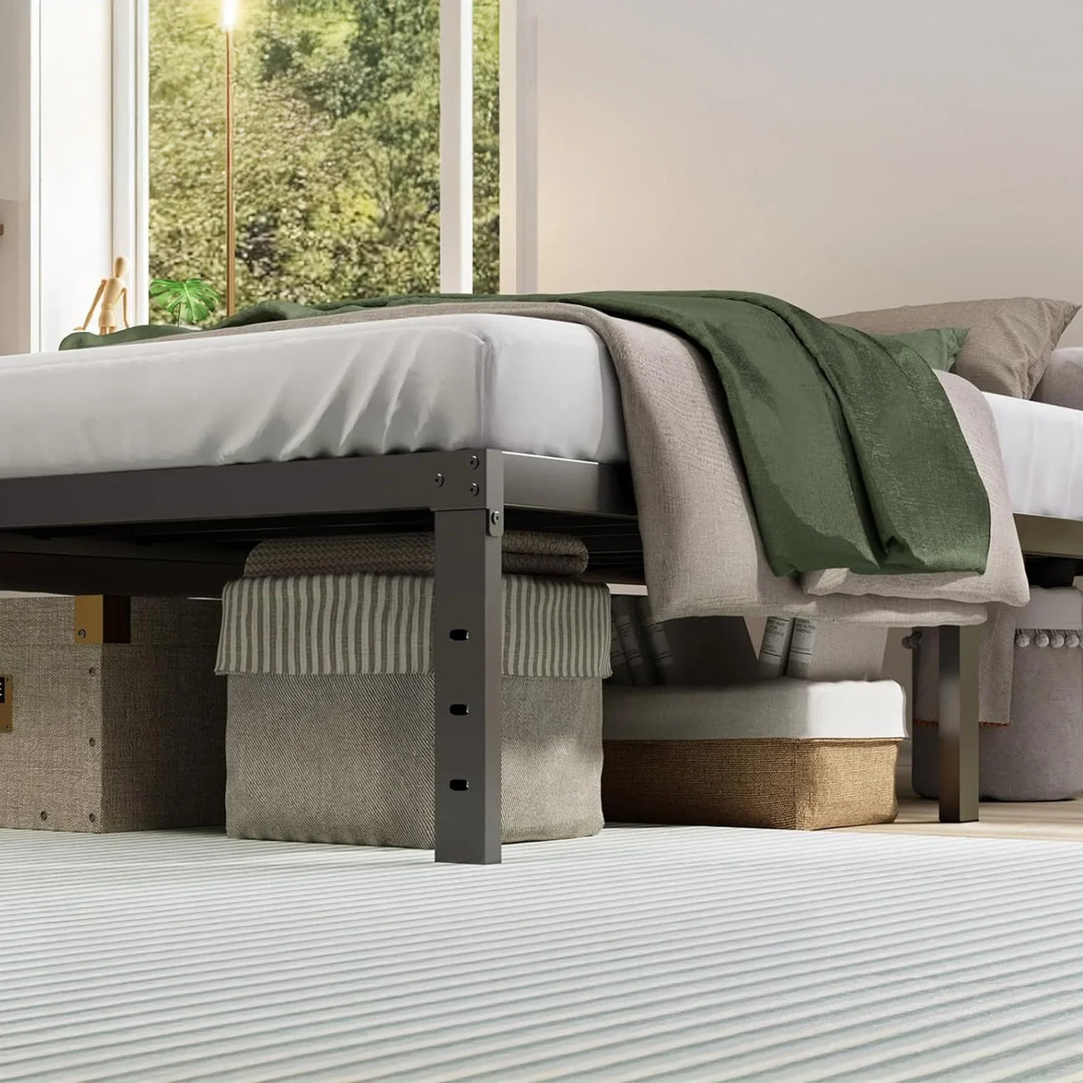 Modern bedroom with storage boxes under metal bed frame, green and beige bedding, HOCC decor.