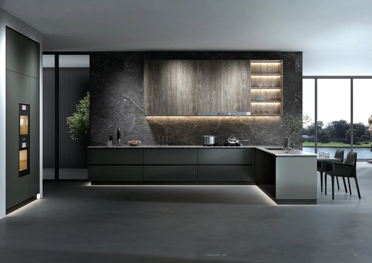 Modern kitchen with dark cabinetry, wood upper cabinets, marble backsplash, and under-cabinet lighting