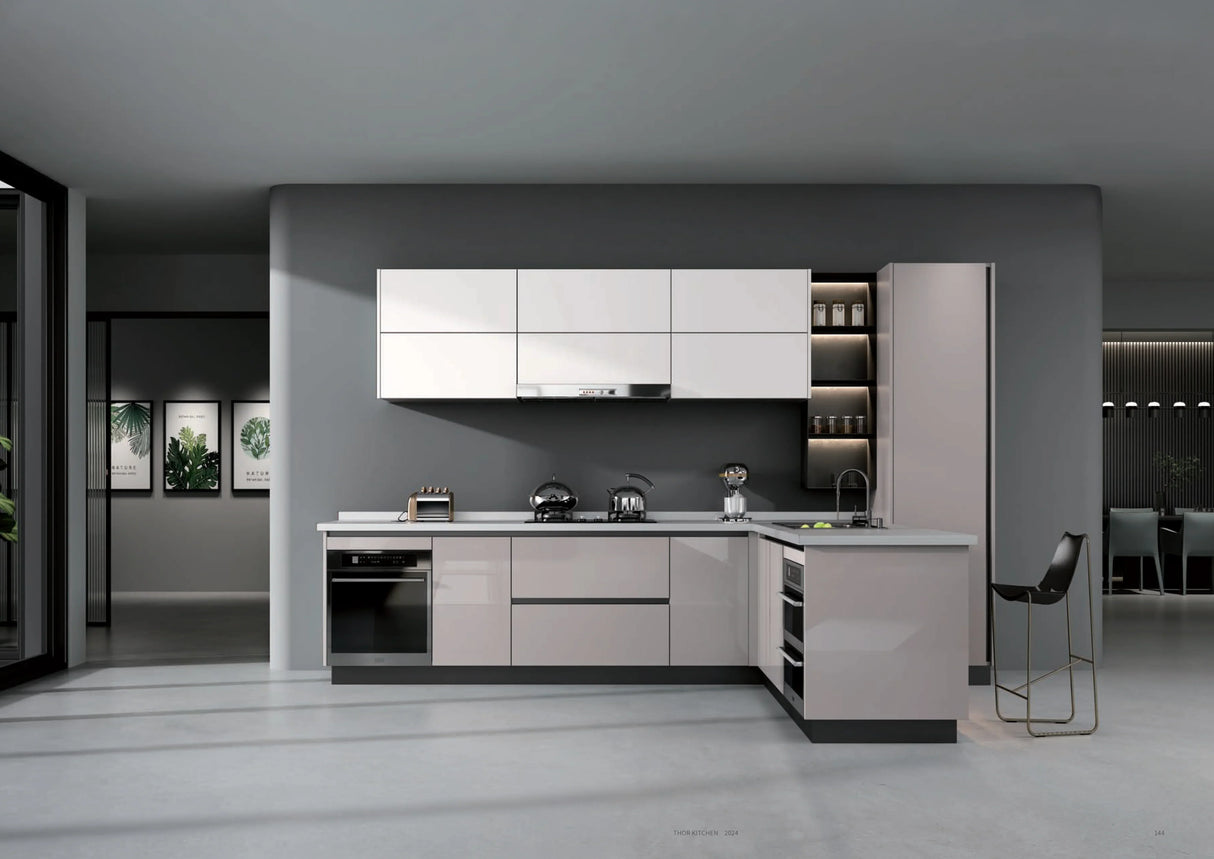 Modern L-shaped kitchen with white and gray cabinets, built-in oven, stove, and minimalist bar stool
