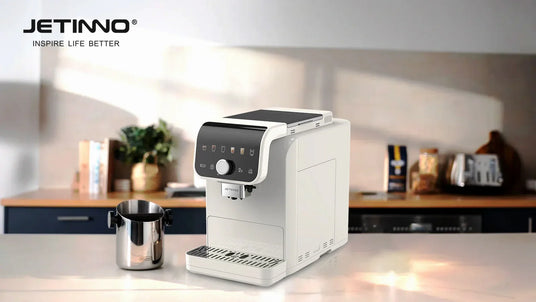 JETINNO white automatic coffee machine on kitchen counter with milk frother jug