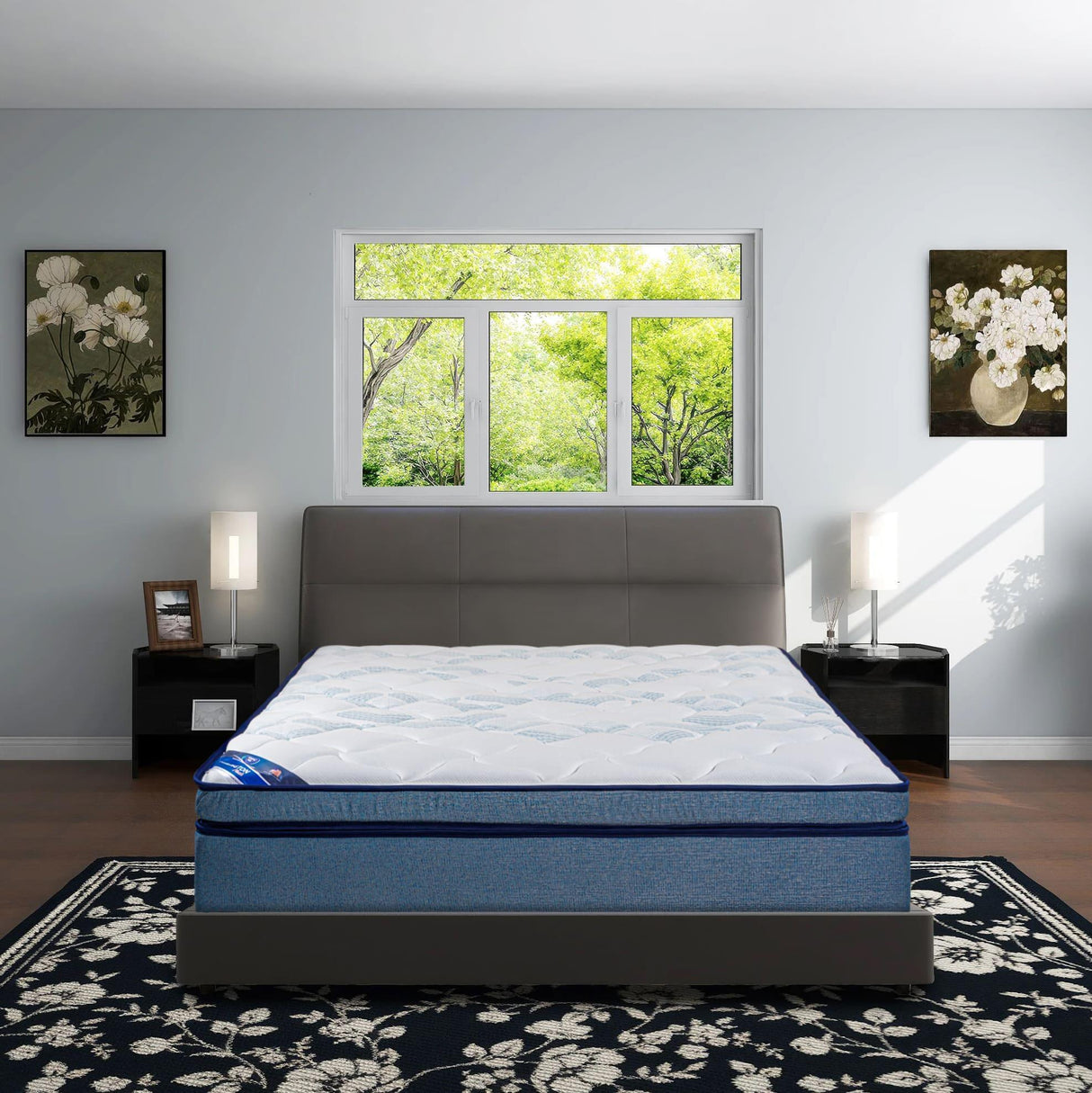Modern bedroom with blue and white mattress on bed, large window, floral decor, and nightstands
