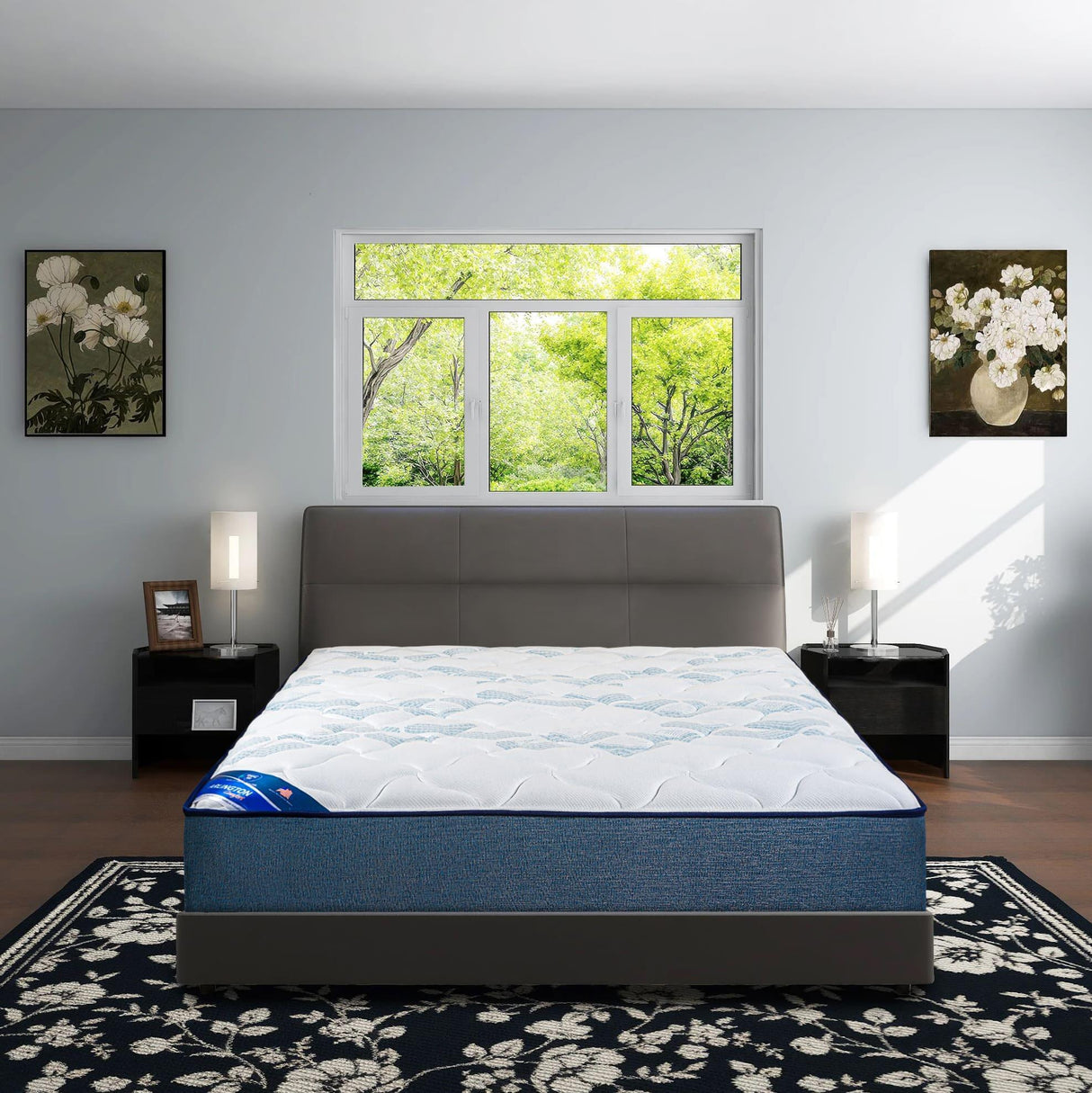 Foam mattress on modern bed in bright bedroom with floral paintings and large window