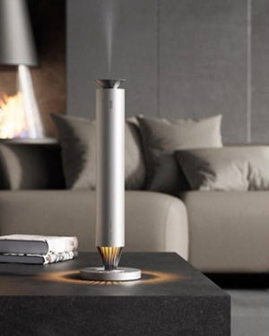 3004 V900S Desktop Aroma Diffuser – Frosted Silver – V900S on coffee table in living room with fireplace