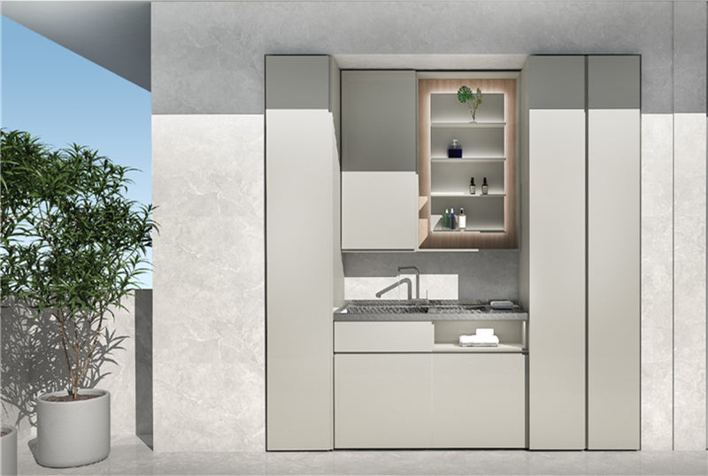 Modern minimalist kitchen with light gray cabinets, open shelving, and a potted plant