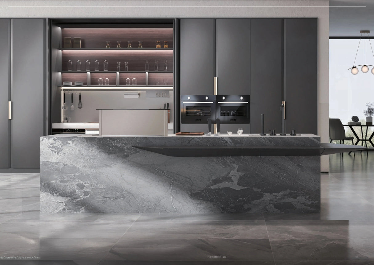 Modern luxury kitchen with gray marble island, dark cabinets, built-in ovens, and open shelving