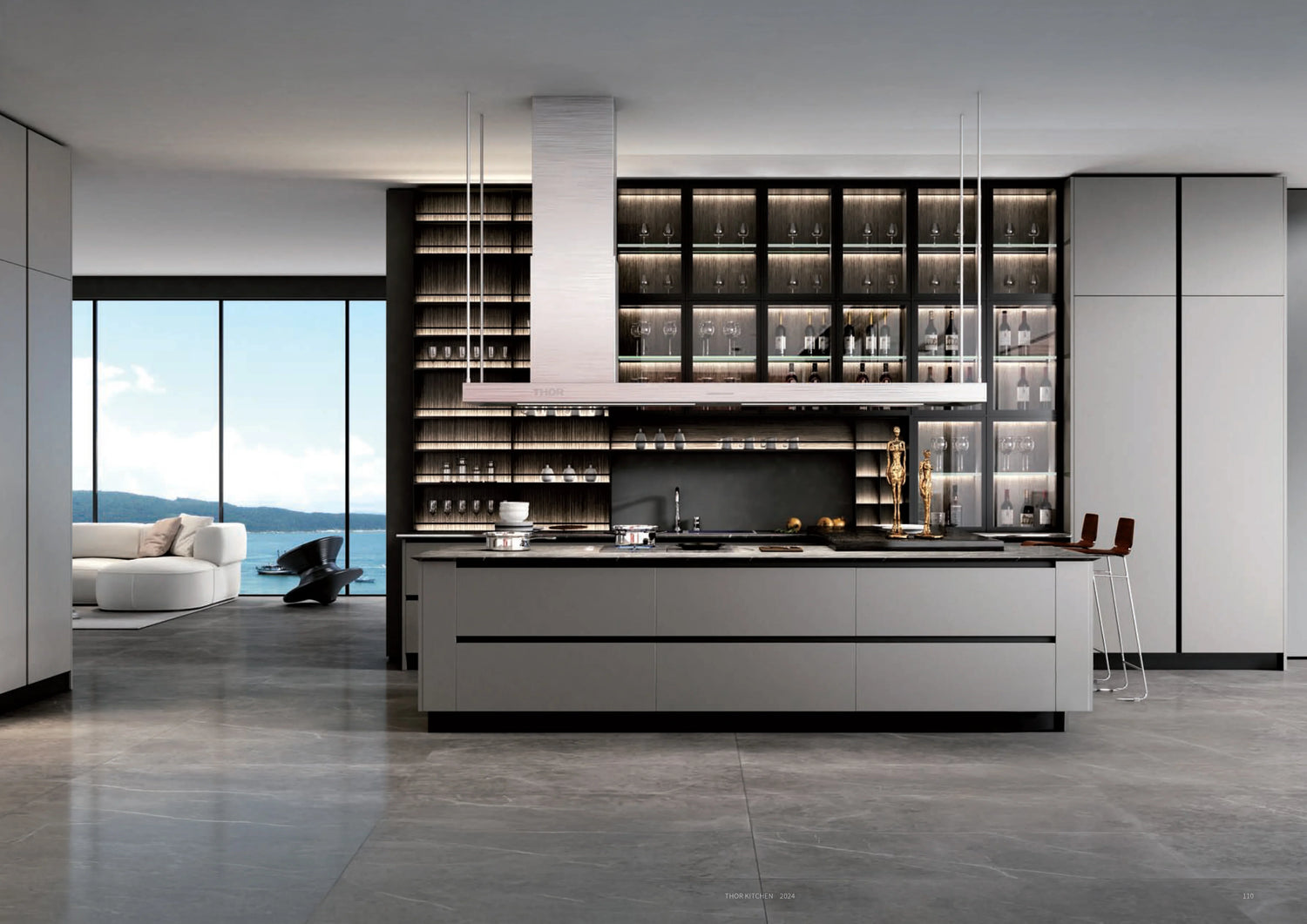 Modern luxury kitchen with gray cabinets, glass shelves, and large windows overlooking water view