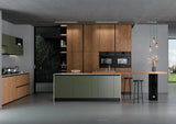Modern kitchen with wood and green cabinets, island, built-in ovens, and minimalist decor