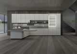 Modern kitchen with sleek white cabinets, central island, open shelves, and wood flooring