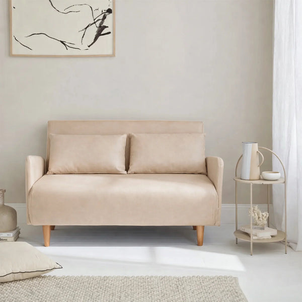 Beige convertible sofa bed in modern living room with side table and abstract wall art, HOCC UAE