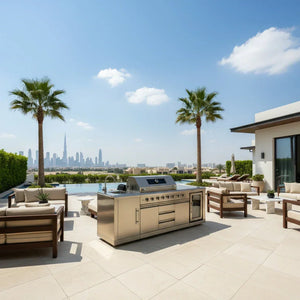 Luxury outdoor kitchen with stainless steel grill island, pool, palm trees, and city skyline view
