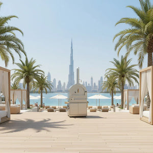 Outdoor dual fuel pizza oven on a sunny wooden deck with palm trees and city skyline view