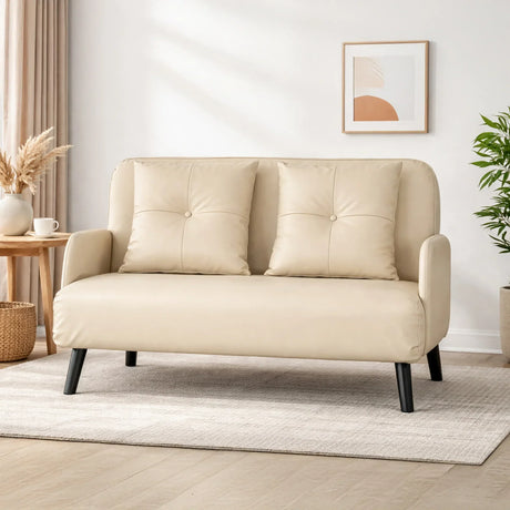 Modern beige two-seater sofa with cushions in a cozy living room, HOCC home decor UAE