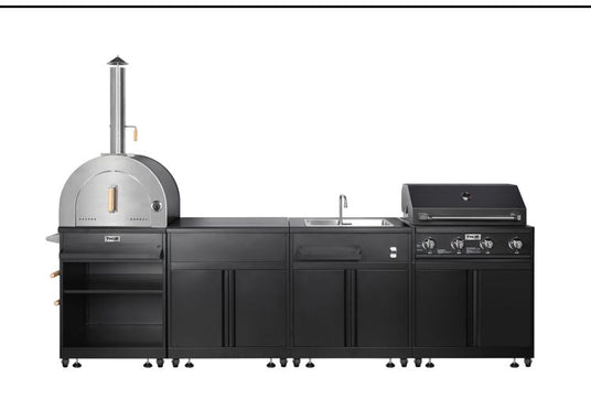 Black outdoor kitchen setup with wood-fired pizza oven, sink, and gas grill on white background