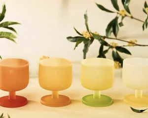MU16 Candy Series Four Seasons Glass Set – 4 Glasses – all four Osmanthus glasses in a row with osmanthus branches, warm cream background