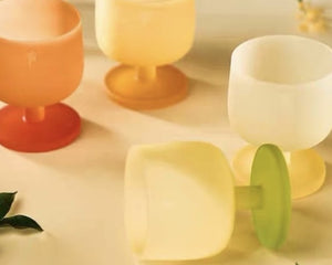 MU16 Candy Series Four Seasons Glass Set – 4 Glasses – four glasses on a cream table, one lying on its side