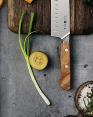 SNF MS2 Avant Classic 7-Inch Santoku Knife – Olive Wood – santoku with olive wood handle on a stone board